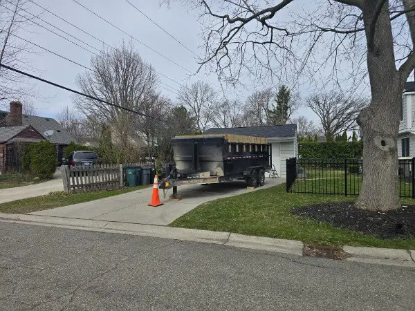 dumpster rental in Beverly Hills MI driveway safe trailer on clean residential driveway