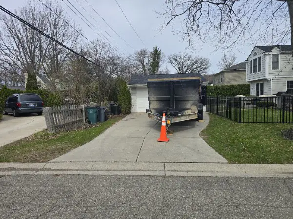 dumpster rental in Beverly Hills MI driveway safe trailer on clean residential driveway