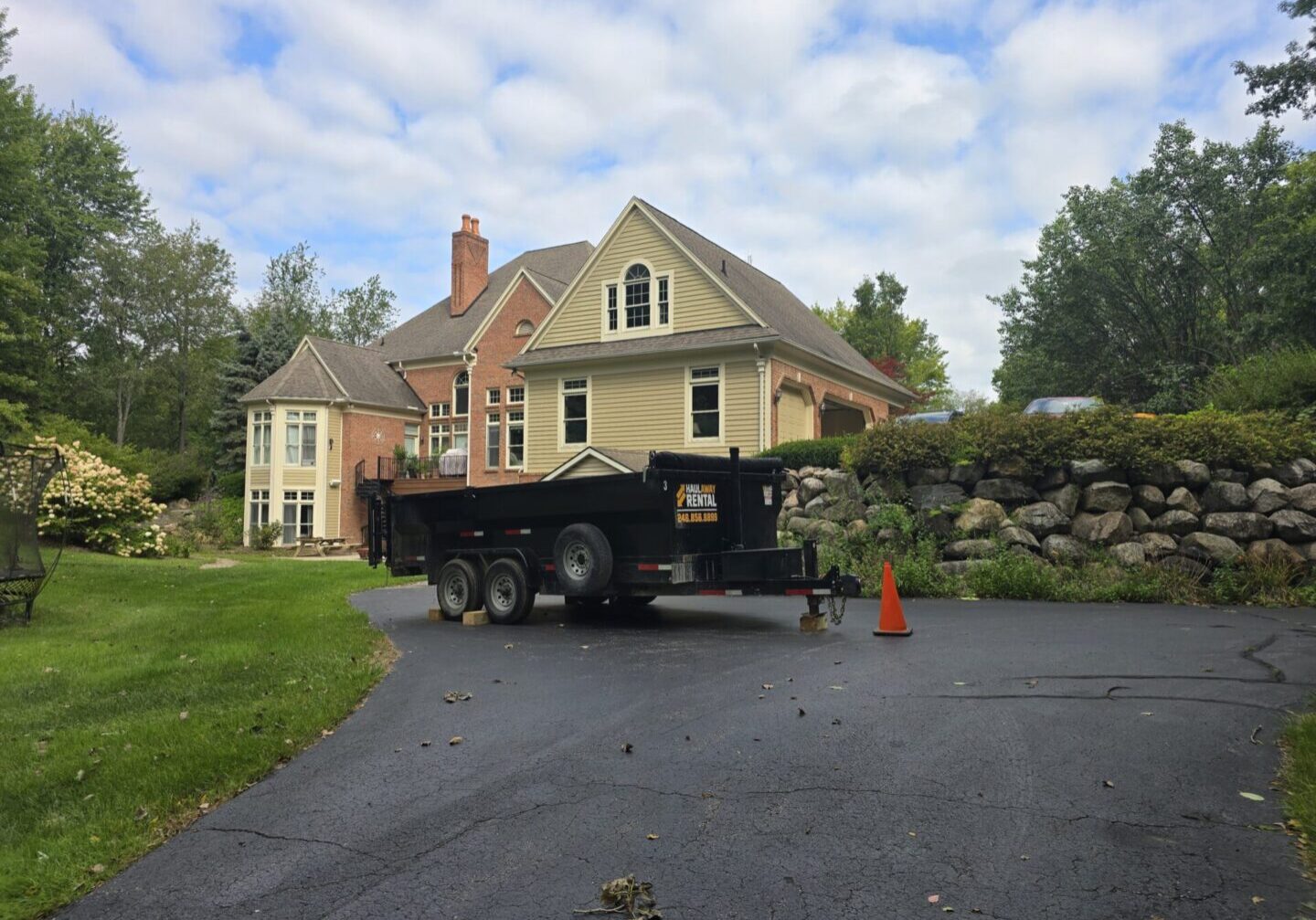 Dumpster rental in Oakland Township MI driveway-safe 20-yard dumpster