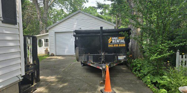 dumpster rental Oakland County MI driveway safe trailer