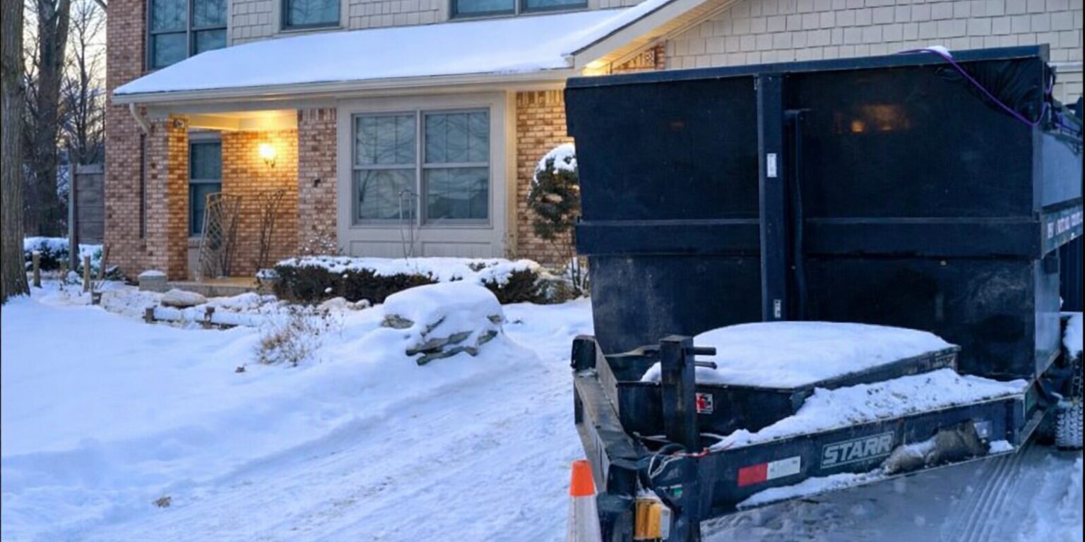dumpster rental in Troy MI driveway safe trailer in snowy residential driveway