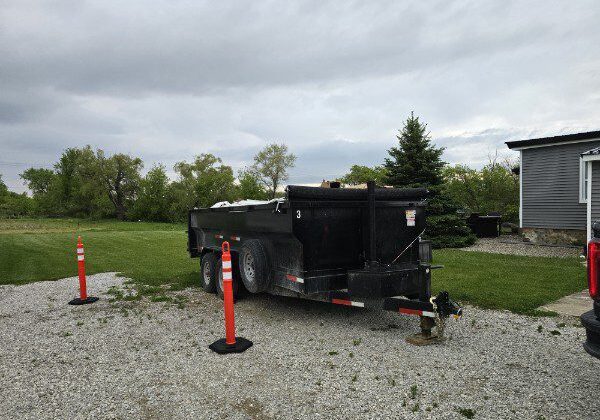 dumpster rental in Washington Township MI driveway safe trailer on large residential driveway