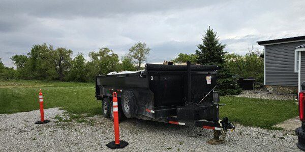 dumpster rental in Washington Township MI driveway safe trailer on large residential driveway